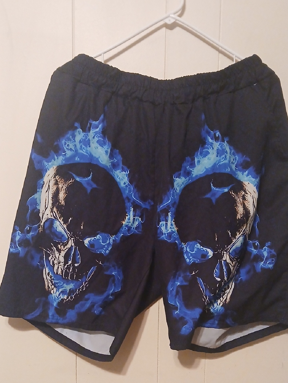 Black Swim Trunks with Blue Flaming Skull Print
